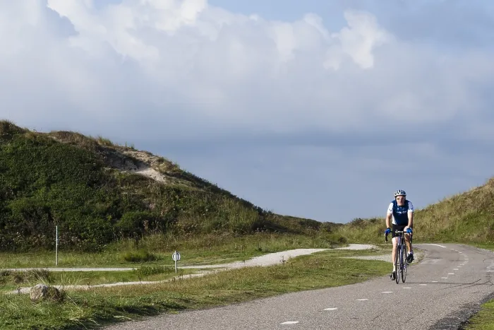 Framed Print : Cyclist in dunes
