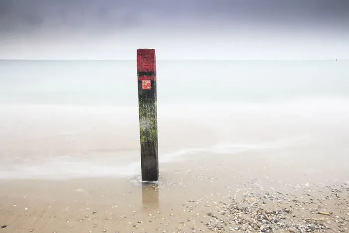 Framed Print : Landmark. Pole on the beach of Texel Framed Print : Landmark. Pole on the beach of Texel