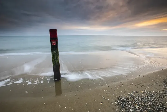 Framed Print : Landmark. Pole on the beach of Texel Framed Print : Landmark. Pole on the beach of Texel