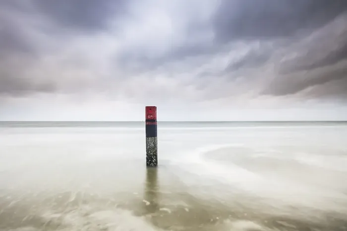 Framed Print : Landmark. Pole on the beach of Texel Framed Print : Landmark. Pole on the beach of Texel